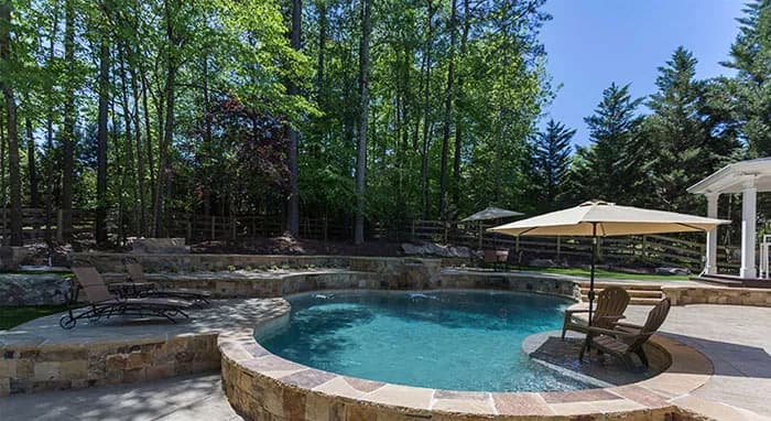 StoneScapes Mini Pebbles: Caribbean Blue Mini — water color and installed finish