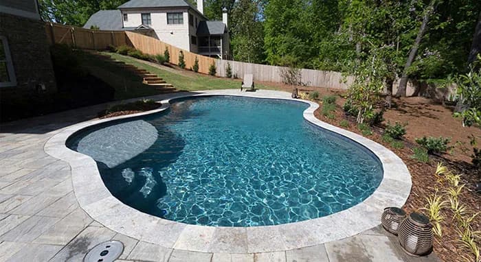 StoneScapes Mini Pebbles: Tropics Blue Mini — water color and installed finish