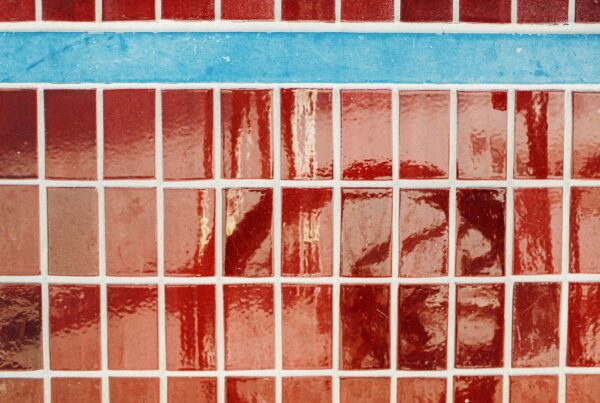 Red and blue mosaic tiles with white grout